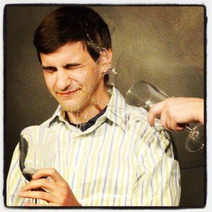 Matt being splashed in the face during a Dictator's Time Machine sketch show.